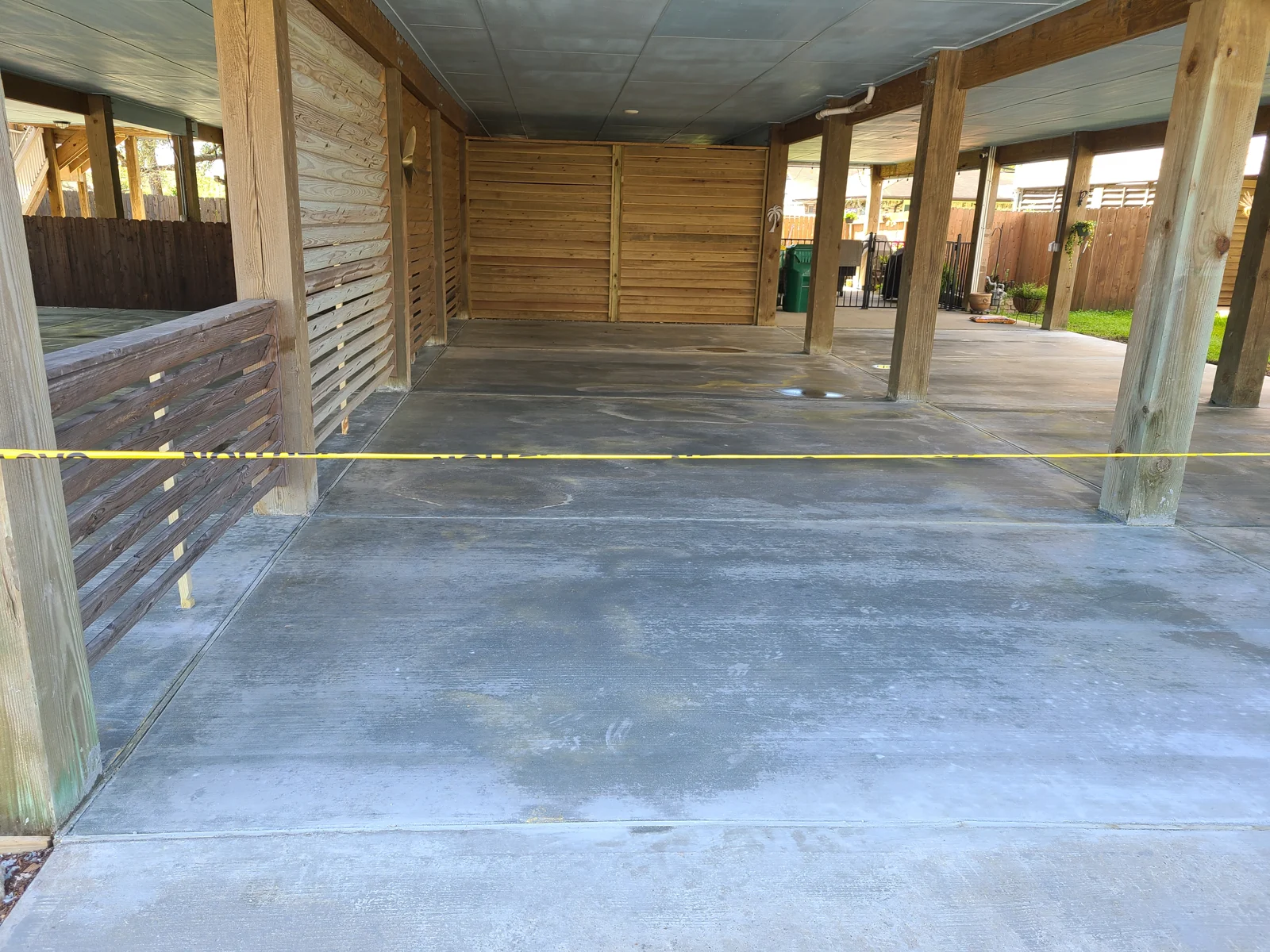 Concrete surface below a raised house