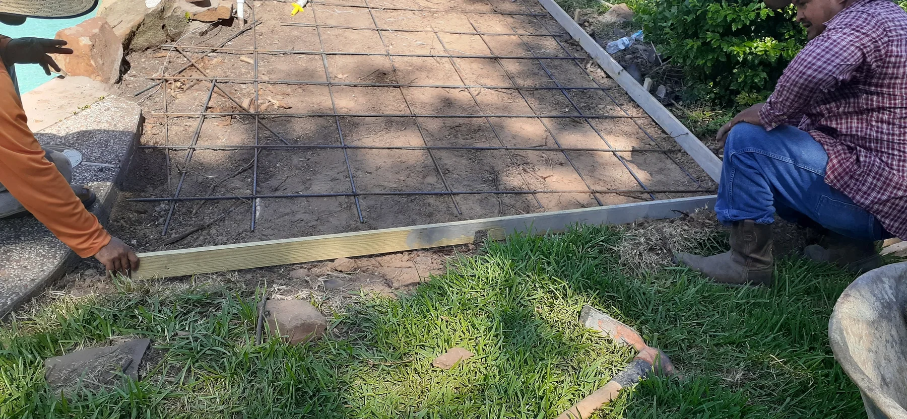 Poolside deck forms and steel reinforcement before concrete was poured
